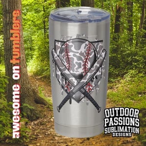 May include: A stainless steel tumbler with a camouflage baseball and crossed bats design. The tumbler has a silver finish and the design is in shades of gray, black, and red. The text "OUTDOOR PASSIONS SUBLIMATION DESIGNS" is printed on the bottom of the tumbler.