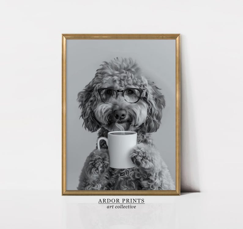 May include: A black and white photo of a dog wearing glasses and holding a white coffee mug. The dog is a poodle with a fluffy coat and a serious expression. The photo is framed in a gold frame.