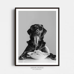 May include: A black and white photo of a dog wearing sunglasses and eating spaghetti. The dog is sitting at a table with a bowl of spaghetti in front of it.
