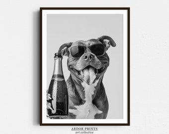 May include: A black and white photo of a dog wearing sunglasses and holding a bottle of champagne. The dog is smiling and has its tongue sticking out.