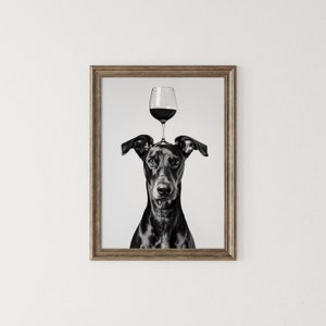 May include: Black and white photo of a dog with a glass of red wine balanced on its head.