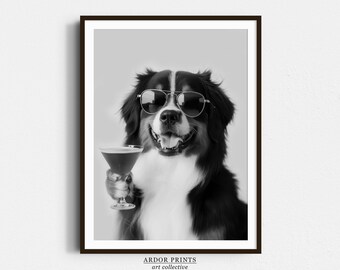 May include: A black and white photo of a Bernese Mountain Dog wearing sunglasses and holding a martini glass. The dog is looking directly at the camera.