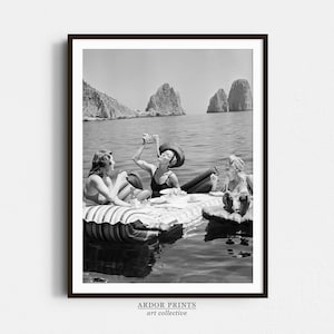 Women Eating Spaghetti Print: Vintage Girls Eating Pasta on Lake, Black And White Art, Picnic On Floaties - Kitchen Wall Decor