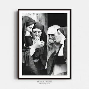 May include: Black and white photograph of four nuns in habits, standing together and smoking cigarettes. The nuns are looking at the camera.