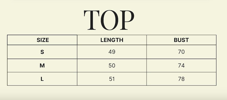 May include: A chart with the word "TOP" at the top. The chart shows size, length, and bust measurements. The length measurements are 49, 50, and 51 cm. The bust measurements are 70, 74, and 78 cm.