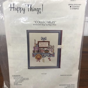 May include: A cross-stitch kit in a clear plastic package. The kit features a design titled "Collectibles" by Patsy's Prints. The image on the kit shows a framed cross-stitch design that measures 8 x 10 inches.