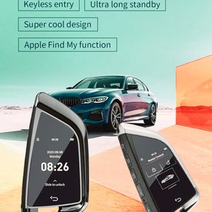 May include: A black and silver car key with a digital display showing the date, time, and "Slide to unlock". The key also has a button for "Master Control".