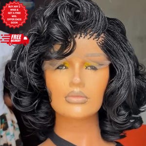 May include: A black braided wig with a curly style. The wig is styled on a mannequin head. The image includes text that says "BUY ANY 2 WIGS & GET A FREE WIG. OFFER ENDS SOON" and "FREE DELIVERY".