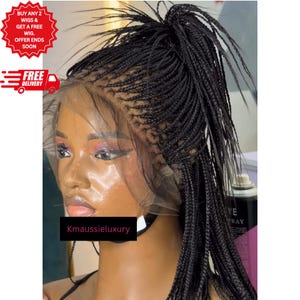 May include: A black braided wig with a lace front, styled in a high ponytail. The wig features small, tightly woven braids. The image includes text that reads "BUY ANY 2 WIGS & GET A FREE WIG. OFFER ENDS SOON" and "FREE DELIVERY."