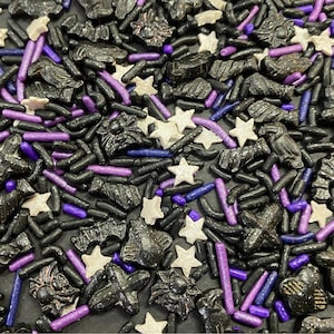 May include: Black, purple, and white sprinkles in the shape of stars, bats, spiders, and sticks. Halloween sprinkles for baking and decorating.