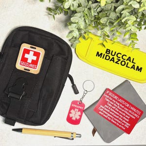 May include: A black tactical pouch with a SEIZURES patch, a yellow case labelled BUCCAL MIDAZOLAM, a red EPILEPSY keychain, a red instruction card, and a bamboo pen. The card reads: IF SEIZURE LASTS FOR 5 MINUTES. Look for my bag that says SEIZURES.