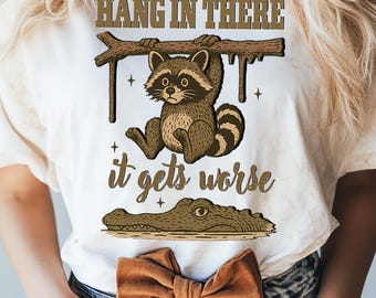 Hang in There It Gets Worse PNG, Funny Sarcastic raccoon png, Snarky Humor png, Retro Aesthetic png, Sassy raccoon png, Trendy Sublimation