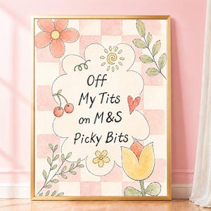May include: A framed wall art print featuring a light pink and white checkered background with watercolor illustrations of flowers, leaves, cherries, and a heart. The center contains a cloud-shaped bubble with the text Off My Tits on M&S Picky Bits.