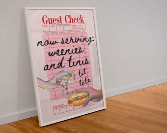 May include: A pink and white guest check with the text "now serving: weenies and tinis til late" written in black marker. A hand holds a martini glass with an olive and another hand holds a hot dog.
