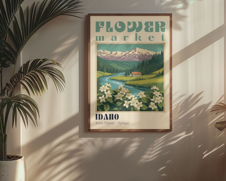 Może przedstawiać: Plakat w stylu vintage reklamujące targ kwiat&oacute;w w Idaho. Plakat przedstawia pasmo g&oacute;rskie, rzekę i małą chatkę. Tekst na plakacie brzmi "Flower Market" i "Idaho, State Flower - Syringa".