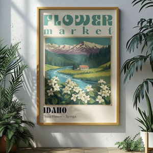 Może przedstawiać: Plakat w stylu vintage reklamujące targ kwiat&oacute;w w Idaho. Plakat przedstawia pasmo g&oacute;rskie, rzekę, mały domek i pole białych kwiat&oacute;w. Tekst na plakacie brzmi "Flower Market, Idaho, State Flower - Syringa."