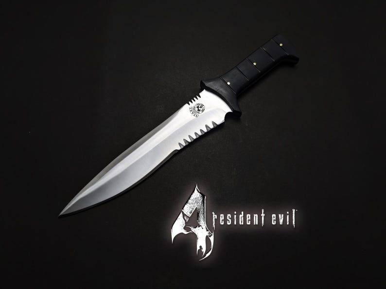 May include: A silver and black dagger with a serrated edge and a black handle with gold rivets. The dagger is displayed on a black surface, with the "Resident Evil 4" logo in the lower right corner.