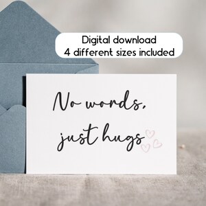 May include: A white card with black text that reads "No words. Just hugs." with three pink hearts.