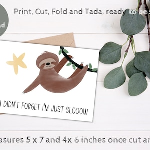 May include: Printable greeting card featuring a sloth hanging from a branch with a yellow star. The card reads "I didn't forget I'm just slooooow". The card measures 5 x 7 inches when folded.