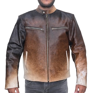 May include: A brown leather jacket with a gradient fade from dark brown to light brown. The jacket has a zipper closure and two pockets on the chest.