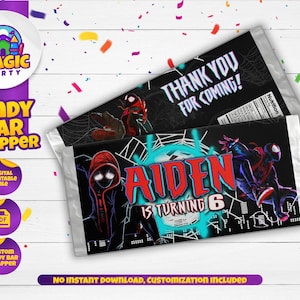 May include: Candy bar wrappers with a superhero theme. One wrapper says "Thank You For Coming!" and the other says "Aiden is Turning 6". The wrappers feature illustrations of superheroes in action poses, with a black and red colour scheme.