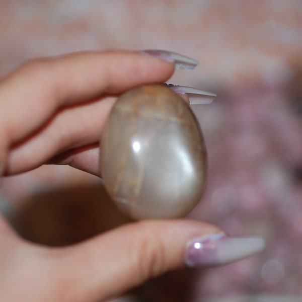 One peach moonstone palm stone