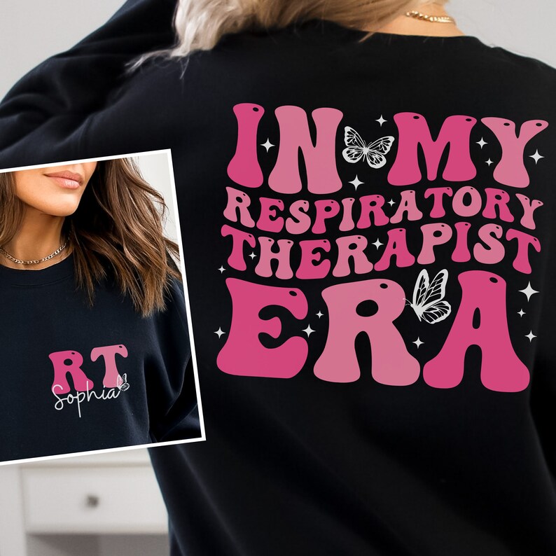 May include: Black sweatshirt with a pink and white graphic that says "In My Respiratory Therapist Era" with butterflies. The front of the sweatshirt has the letters "RT" and the name "Sophia" in white.
