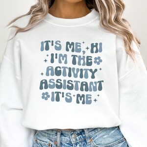 Trendy Shirts for Activity Assistant, It's Me Hi, I'm the Activity Assistant Sweatshirt, Activity Director Gift for Assistant Professional image 5