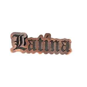 May include: Wooden sign with the word "Latina" carved in black lettering.