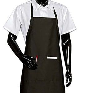 May include: A black apron with a white pocket and a red pen in the pocket. The apron is being worn by a mannequin.