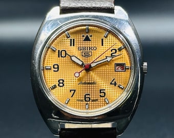 Vintage Seiko 5 Automatik Herrenuhr : Orangefarbenes Ziffernblatt, silberfarbenes Gehäuse, aus Japan