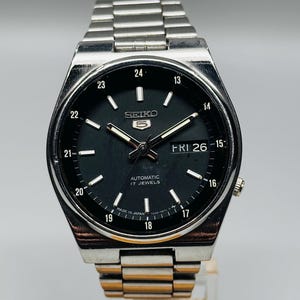 Preowned  Seiko 5 Automatic Black Dial , Silver Case Day/Date Caliber No.7009 Wrist Watch Japan Made