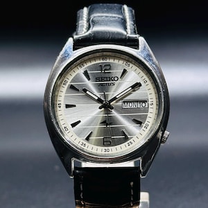 Reloj de pulsera automático Seiko Actus vintage con esfera plateada, caja plateada, día/fecha, calibre n.° 6119A, para hombre, fabricado en Japón.