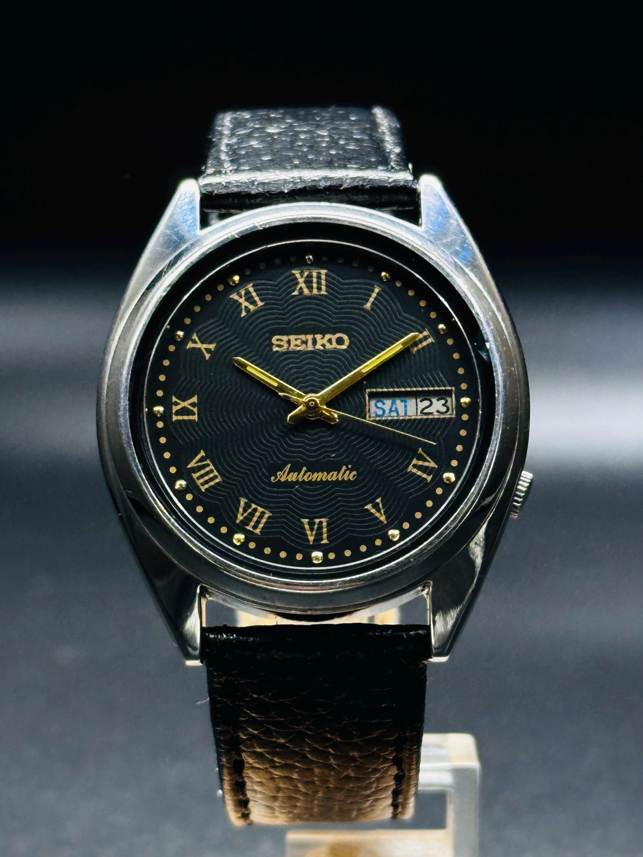 Rare Vintage Seiko 5 Automatic Roman Black Dial Silver Case Day/Date Caliber No.7009A Men's Wrist Watch Japan Made
