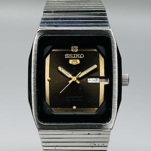 Raro reloj de pulsera Seiko 5 automático vintage de segunda mano, esfera negra, caja plateada con fecha y día, calibre n.° 4219A, para hombre, fabricado en Japón.