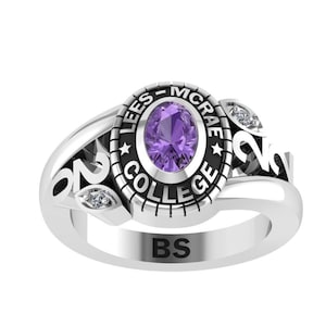 May include: A silver class ring with a purple stone and the inscription "Lees-McRae College" and "BS".