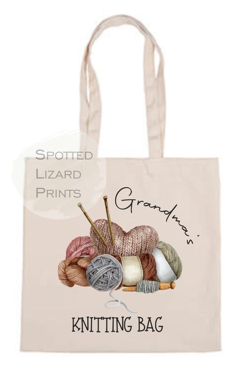 May include: Beige tote bag with a watercolor illustration of yarn balls, knitting needles, and a knitted heart. The text "Grandma's Knitting Bag" is printed on the bag.