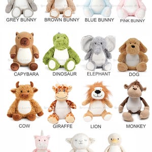 May include: A collection of fourteen plush stuffed animals including a grey, brown, blue, and pink bunny, a capybara, dinosaur, elephant, dog, cow, giraffe, lion, monkey, unicorn, lamb, and duck, each featuring a white belly and soft texture.
