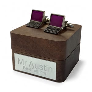 May include: Silver laptop cufflinks with purple screens sit on a dark wooden box. The box features a silver nameplate engraved with "Mr Austin Best Teacher". A thoughtful gift.