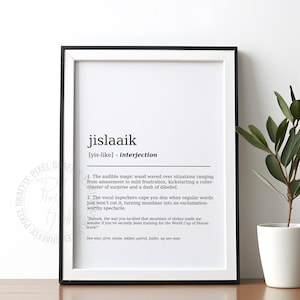 May include: A framed wall art print featuring a dictionary-style definition of the word jislaaik. The text is printed in black on a white background, presented in a thin black frame. The definition includes phonetic spelling and two numbered examples.