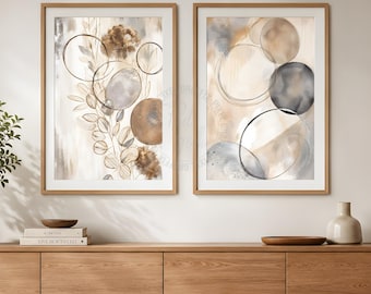 May include: Two framed vertical wall art prints featuring abstract compositions of overlapping circles, soft watercolor washes in shades of beige, brown, and grey, and delicate botanical line drawings of leaves and stems on a light background.