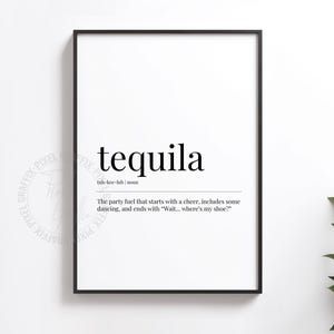 May include: Black framed print with the word "tequila" in a bold, sans-serif font. Below, the definition reads: "The party fuel that starts with a cheer, includes some dancing, and ends with 'Wait... where's my shoe?'"