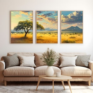 May include: Three framed landscape prints depicting a savanna scene with a solitary tree in the foreground and a mountain range in the distance. The sky is blue with white clouds.