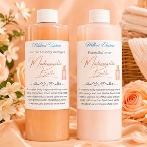 May include: Two clear plastic bottles with white screw caps, one containing orange liquid labelled Non Bio Laundry Detergent and the other containing pale pink liquid labelled Fabric Softener. Both feature the text Willows Charms Mademoiselle Belle.