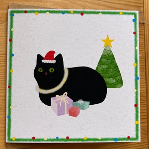 Carte de Noël faite main de chat noir/carte de voeux festive d'hiver vierge avec une jolie illustration de décorations de miche de chaton, étoile d'arbre
