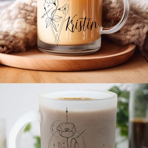 May include: Two coffee mugs with floral designs and personalized names. The first mug is clear glass with a floral design and the name "Kristin". The second mug is frosted glass with a poppy flower design and the name "Kay".