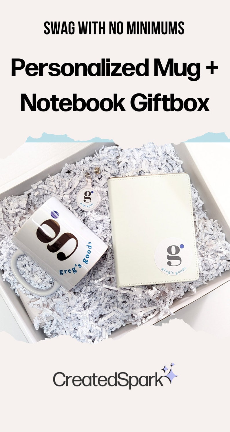 May include: A white gift box filled with white shredded paper. The box contains a white mug with a blue and black logo that says "g. greg's goods", a white notebook with a blue and black logo that says "g. greg's goods", and a white keychain with a blue and black logo that says "g. greg's goods". The box is labeled "CreatedSpark".