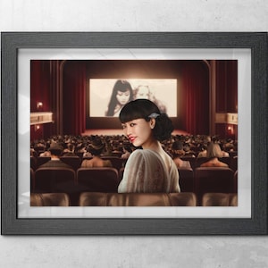 May include: A framed print featuring a person with dark hair styled in a bun, wearing a light-colored garment, looking over their shoulder inside a movie theater. The screen displays a black and white film scene, and the audience sits in rows.
