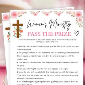 May include: A printed game sheet for a Women's Ministry event, featuring a wooden cross and floral accents. The text reads "Women's Ministry PASS THE PRIZE" with game instructions. The design includes pink and green floral elements.