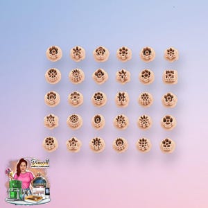 May include: A collection of thirty small, light peach-colored plastic clay cutters arranged in a grid. Each cutter features a distinct geometric or floral shape with intricate internal details, designed for creating precise impressions in soft materials.